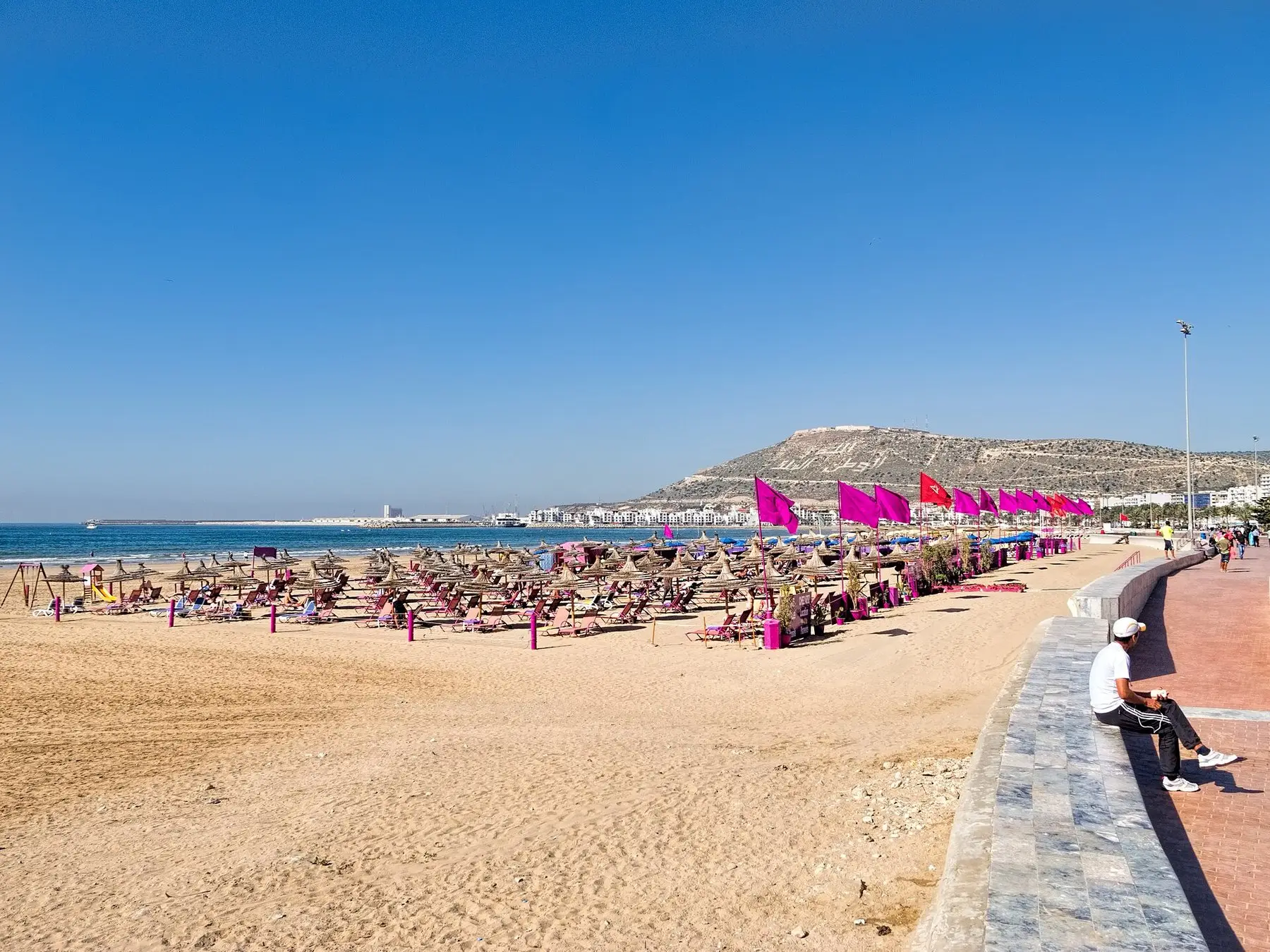 The long sandy crescent of Agadir beach with the city behind