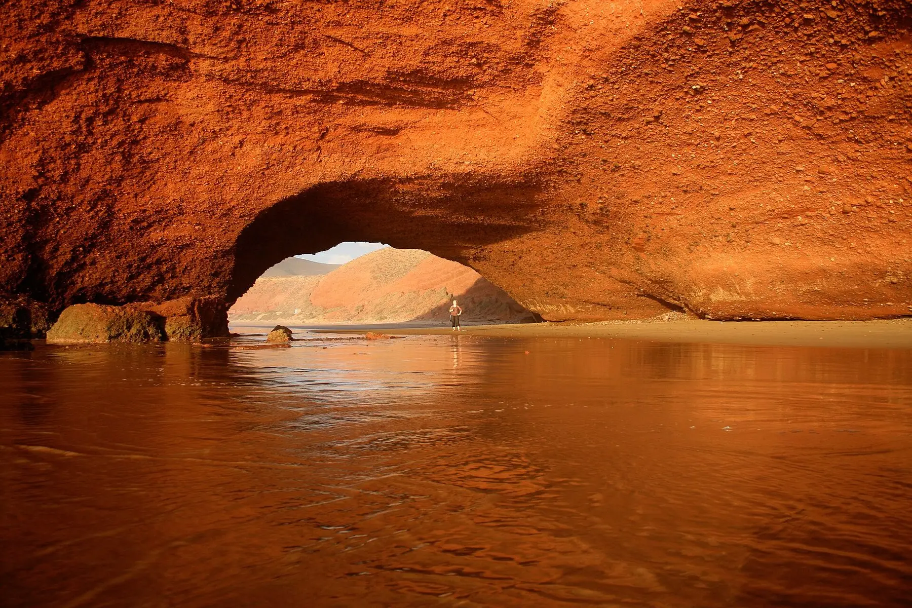 The remaining red rock arch on Legzira beach at low tide